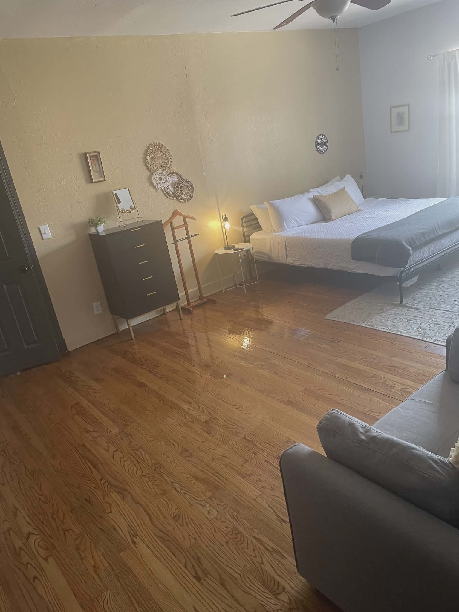 Spotless master bedroom with gleaming hardwood floors