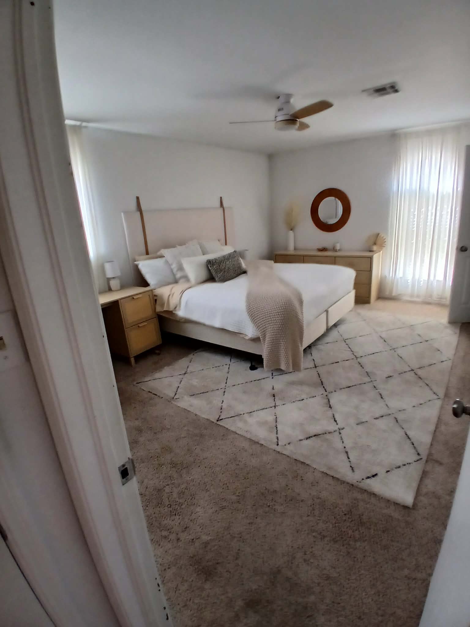 Modern bedroom with clean carpets and fresh linens