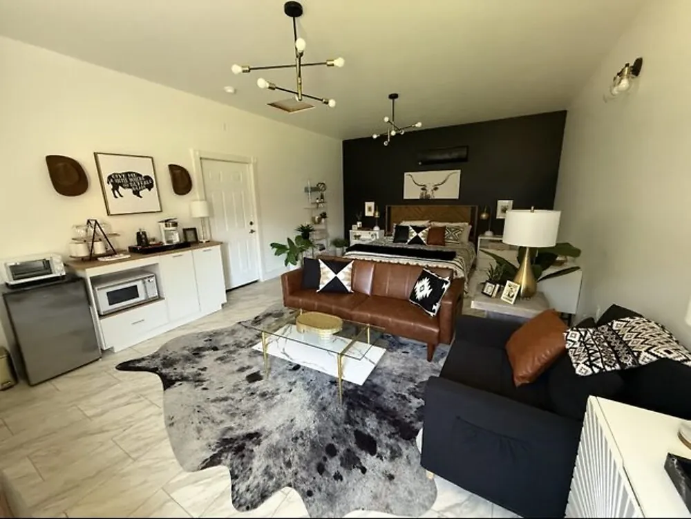 A Blanc Co cleaned open living room with chandelier in the OKC metro